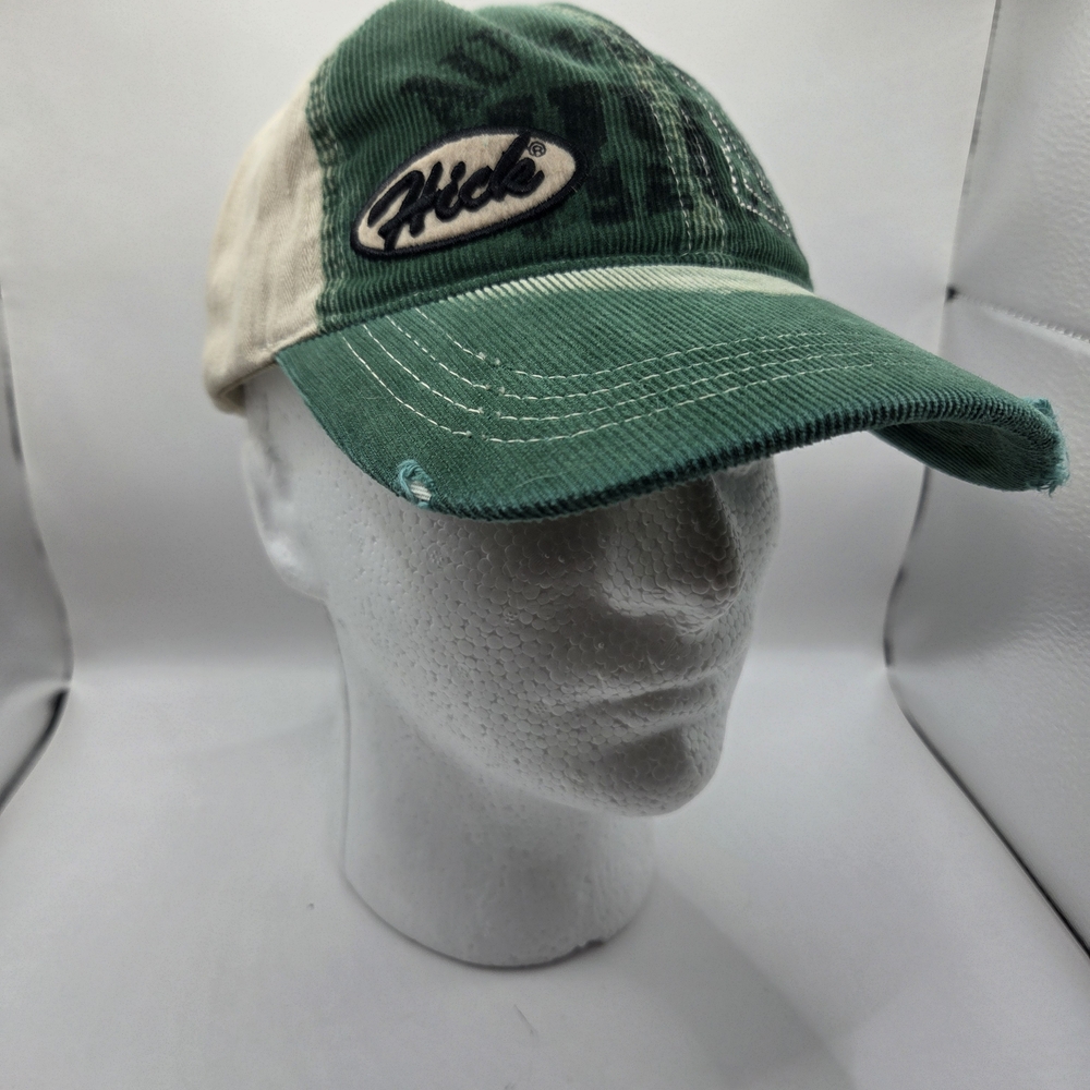 Green and beige corduroy baseball cap with a "Hick" logo